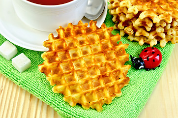 Image showing Waffles circle with tea on a napkin