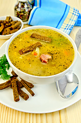 Image showing Soup pea with croutons and napkin