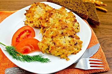 Image showing Fritters chicken with vegetables and bread on a board