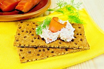 Image showing Bread with mayonnaise and salmon on board