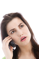 Image showing Woman listening to a call on a mobile