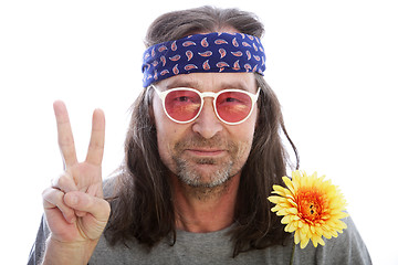 Image showing Male hippie making a peace sign