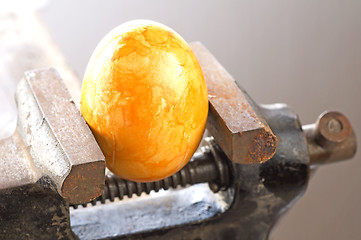 Image showing Egg in a bench vise