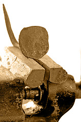 Image showing Bench vise with twisted nail
