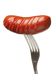 Image showing Grilled smoked sausage on a fork