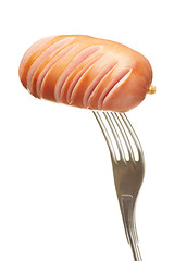 Image showing Grilled sausage on a fork