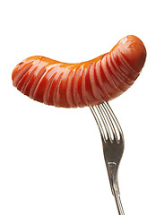 Image showing Grilled sausage on a fork