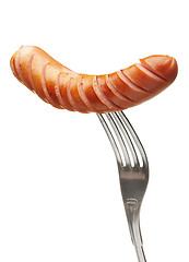 Image showing Grilled sausage on a fork
