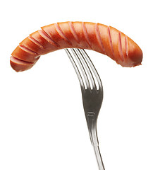 Image showing Grilled sausage on a fork