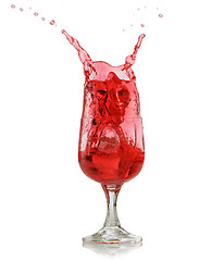 Image showing red splashing drink in wine glass