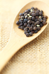 Image showing black pepper in wooden spoon