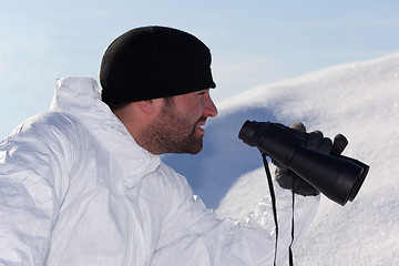 Image showing Commandos  in white camouflage looking through binoculars. Portr