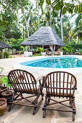 Image showing Chairs on swimming pool border