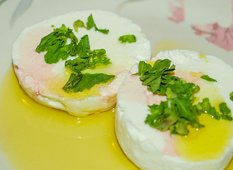 Image showing Tomino cheese with rucola and olive oil