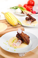 Image showing pork ribbs on polenta corn cream bed