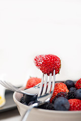 Image showing srawberry on a fork isolated