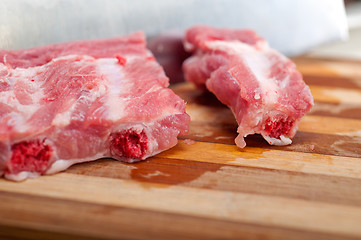 Image showing chopping fresh pork ribs 