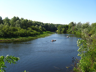 Image showing beautiful landscape with river and canoe on it