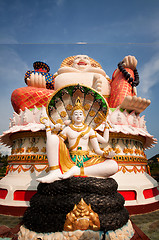 Image showing Fat laughing Buddha over blue sky