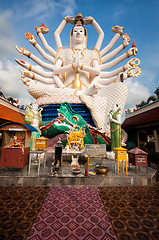 Image showing Eighteen arms Buddha over blue sky