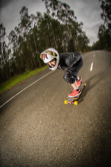 Image showing Downhill skateboarder in action