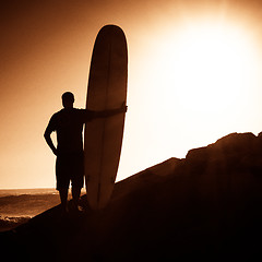 Image showing Long boarder watching the waves