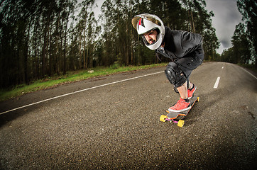 Image showing Downhill skateboarder in action