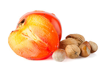 Image showing Ripe persimmons and nuts