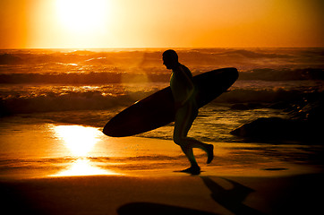 Image showing Surfer running