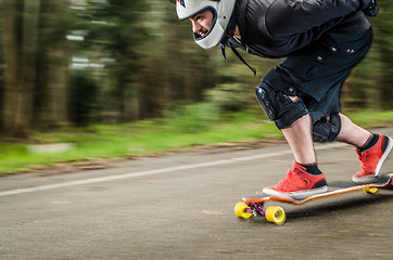 Image showing Downhill skateboarder in action