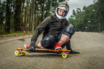 Image showing Downhill skateboarder in action