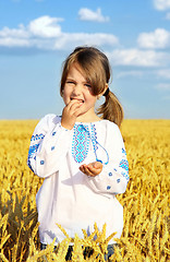 Image showing small rural girl on wheat field