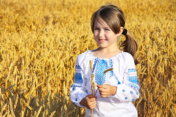 Image showing small rural girl on wheat field