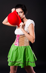 Image showing German pretty girl covers by hat