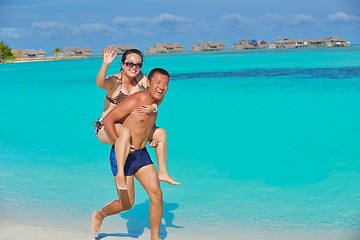 Image showing happy young  couple enjoying summer on beach