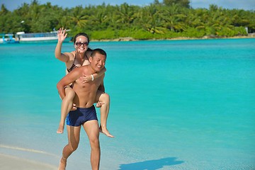 Image showing happy young  couple enjoying summer on beach