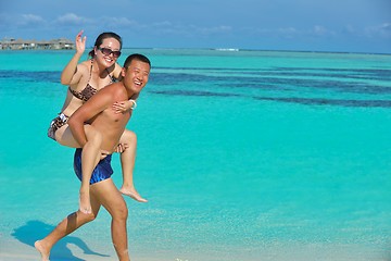 Image showing happy young  couple enjoying summer on beach