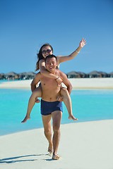 Image showing happy young  couple enjoying summer on beach