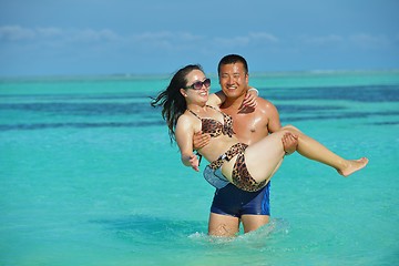 Image showing happy young  couple enjoying summer on beach