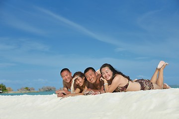 Image showing group of happy young people have fun on bach