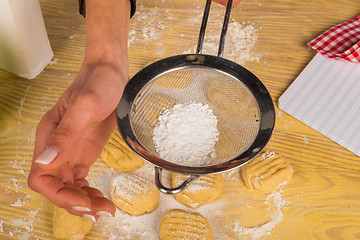 Image showing Icing sugar on cookies