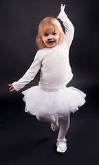 Image showing 2 years old girl dancing in white