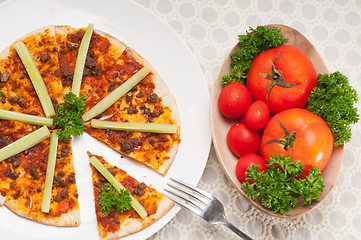 Image showing Turkish beef pizza with cucumber on top