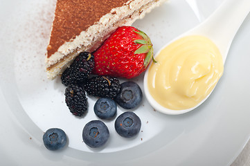 Image showing tiramisu dessert with berries and cream