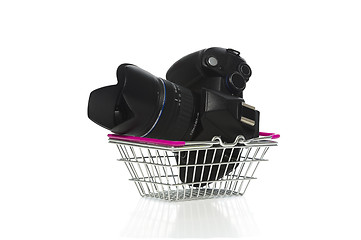 Image showing Camera and lens in a shopping basket