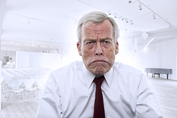 Image showing Upset Caucasian businessman with huge frown