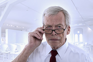 Image showing Senior man peering at the camera