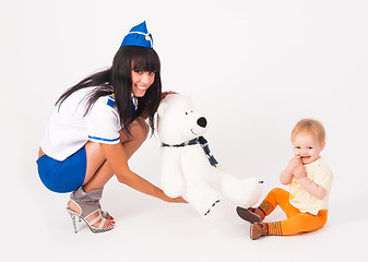 Image showing Attractive stewardess and baby girl