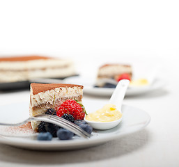 Image showing tiramisu dessert with berries and cream