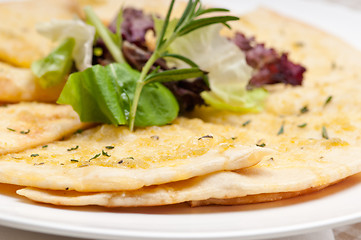 Image showing garlic pita bread pizza with salad on top